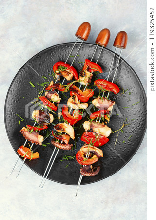 Exotic grilled octopus skewers. 119325452