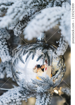 smiling women reflection in christmas tree toy smiling women reflection in christmas tree toy 119325899