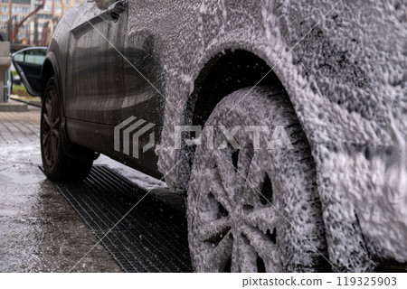 SUV Being Washed at Car Wash SUV Being Washed at Car Wash 119325903