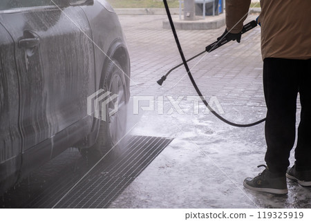SUV Being Washed at Car Wash SUV Being Washed at Car Wash 119325919