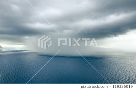 Cloudburst over the ocean near the coast Cloudburst over the ocean near the coast 119326019