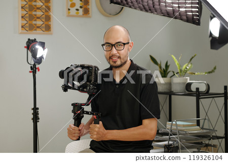 Young Cameraman With Professional Camera 119326104