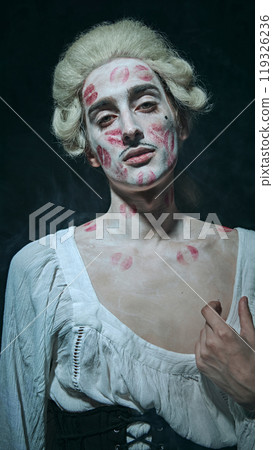 Modern aristocracy. nobleman with white powdered hair exudes confidence, kissed with bold lipstick marks, against vintage background. Modern aristocracy. nobleman with white powdered hair exudes confidence, kissed with bold lipstick marks, against vintage background. 119326236