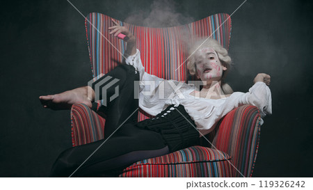 Surrounded by smoke, medieval person with kiss marks smokes, blending historical costume with modern vice. 119326242
