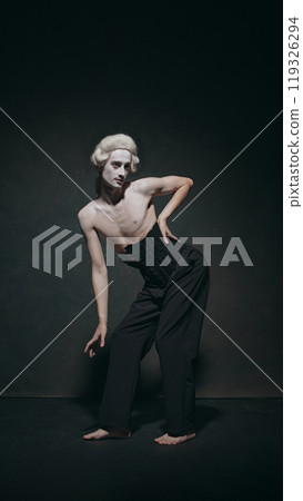 Portrait of man, medieval person poised, almost fluid stance, show fashion, history, and dance with artistic, ballet elegance. 119326294