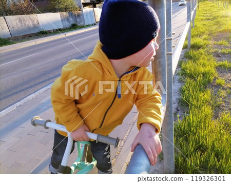 Adorable toddler boy having fun on playground Adorable toddler boy having fun on playground 119326301