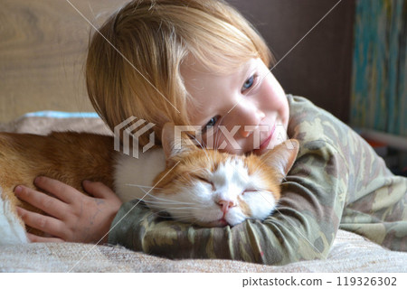 Portrait of a child aged four years old whit sleeping red cat Portrait of a child aged four years old whit sleeping red cat 119326302
