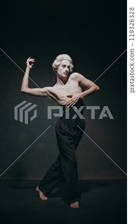 Young man dancing combining elements of ballet with historical flair, elegantly bridging old and new worlds. Vintage background. Young man dancing combining elements of ballet with historical flair, elegantly bridging old and new worlds. Vintage background. 119326328