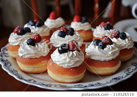Mini donuts topped with strawberries and blueberries Mini donuts topped with strawberries and blueberries 119326519