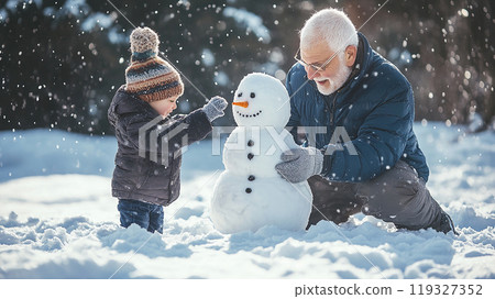 Grandfather and grandson playing with a snowman 119327352