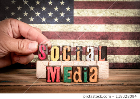 SOCIAL MEDIA. Colorful letters of the alphabet on a wooden texture table 119328094