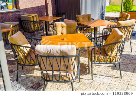 Charming and Cozy Outdoor Cafe Seating, Featuring Cushioned steel Chairs for Ultimate Comfort Charming and Cozy Outdoor Cafe Seating, Featuring Cushioned steel Chairs for Ultimate Comfort 119328909