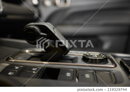 Macro shot of a car gear lever an essential auto part Macro shot of a car gear lever an essential auto part 119329744
