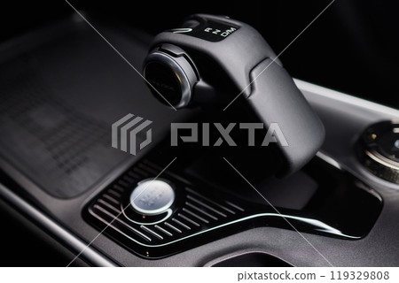 Macro shot of a car gear lever an essential auto part Macro shot of a car gear lever an essential auto part 119329808