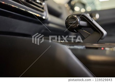 Macro shot of a car gear lever an essential auto part Macro shot of a car gear lever an essential auto part 119329843