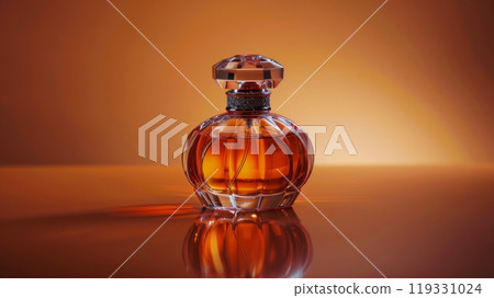 A beautifully crafted glass perfume bottle with an intricate design and vibrant orange liquid 119331024