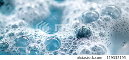 Extreme close up of delicate soap bubbles with various sizes, showcasing iridescent surfaces and reflections in shades of blue and white Extreme close up of delicate soap bubbles with various sizes, showcasing iridescent surfaces and reflections in shades of blue and white 119332193
