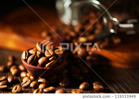 Coffee beans spilling from a coffee canister Coffee beans spilling from a coffee canister 119333949