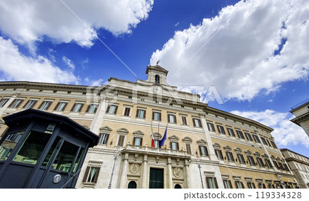 Facade of Palazzo Montecitorio in Rome with Italian and European flags 119334328