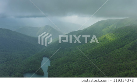 Clouds over summer green mountains 119334378