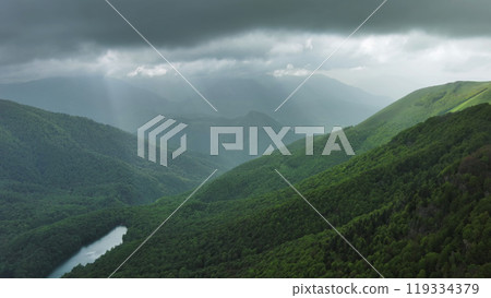 Clouds over summer green mountains Clouds over summer green mountains 119334379