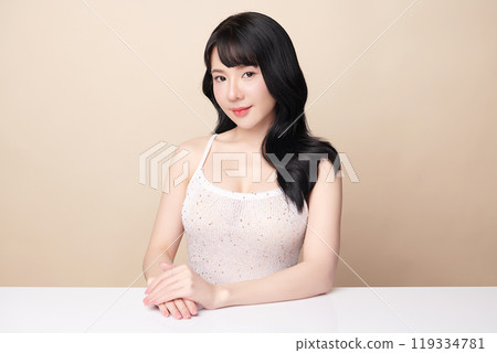 Beautiful young asian woman with clean fresh skin on beige background, Face care, Facial treatment, Cosmetology, beauty and spa, Asian women portrait. 119334781