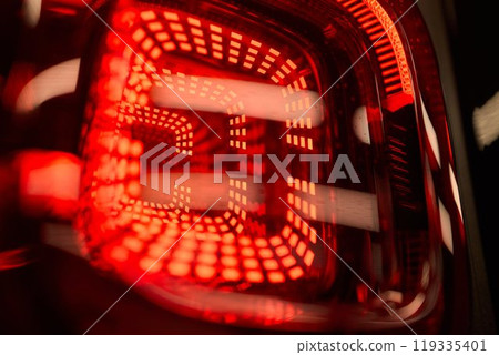 Closeup of a cars automotive tail brake light Closeup of a cars automotive tail brake light 119335401