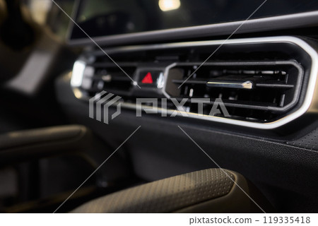 Closeup of car dashboard air vents near gear shift Closeup of car dashboard air vents near gear shift 119335418