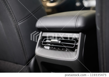 A close up of a car s rear air conditioning system A close up of a car s rear air conditioning system 119335473