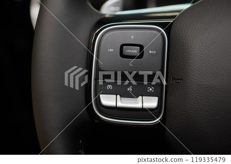 The modern cars steering wheel control panel boosts convenience and performance The modern cars steering wheel control panel boosts convenience and performance 119335479
