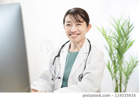 Smiling female doctor talking 119335638