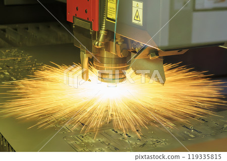 The fiber laser cutting machine cut the metal plate with the sparkling light. 119335815