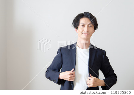 Young man looking towards you, business casual Young man looking towards you, business casual 119335860