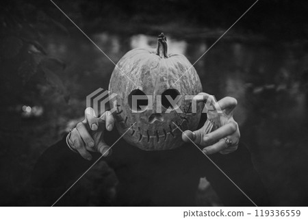 Scary man with pumpkin head for Halloween. Jack-o-lantern costume.Trick or treat, scares you, playing in horror stories 119336559