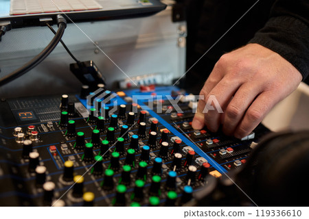 DJ Mixing Console with Colorful Controls, Hand Features, and Audio Adjustments for Pros DJ Mixing Console with Colorful Controls, Hand Features, and Audio Adjustments for Pros 119336610