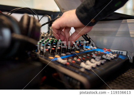 DJ Mixing Console with Colorful Controls, Hand Features, and Audio Adjustments for Pros DJ Mixing Console with Colorful Controls, Hand Features, and Audio Adjustments for Pros 119336613