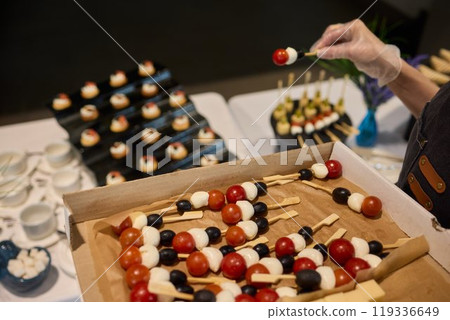 A Vibrantly Colorful Appetizer Platter Featuring Skewers and a Variety of Fresh Ingredients A Vibrantly Colorful Appetizer Platter Featuring Skewers and a Variety of Fresh Ingredients 119336649