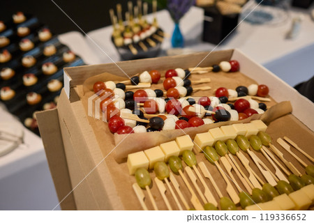 A Vibrantly Colorful Appetizer Platter Featuring Skewers and a Variety of Fresh Ingredients A Vibrantly Colorful Appetizer Platter Featuring Skewers and a Variety of Fresh Ingredients 119336652