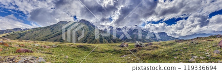 Scenic view of the Cross Pass in Georgia, showcasing lush green mountains and a winding valley 119336694