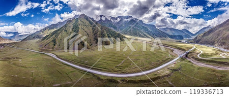 Drone view of the Cross Pass in Georgia, showcasing winding roads and mountainous terrain Drone view of the Cross Pass in Georgia, showcasing winding roads and mountainous terrain 119336713