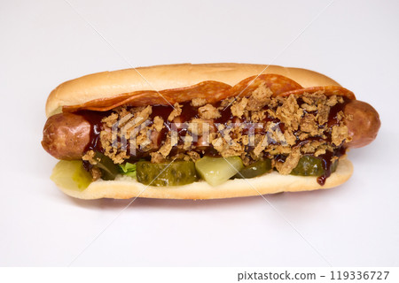 Gourmet Hot Dog featuring Crispy Toppings along with a delicious Sauce for extra flavor Gourmet Hot Dog featuring Crispy Toppings along with a delicious Sauce for extra flavor 119336727