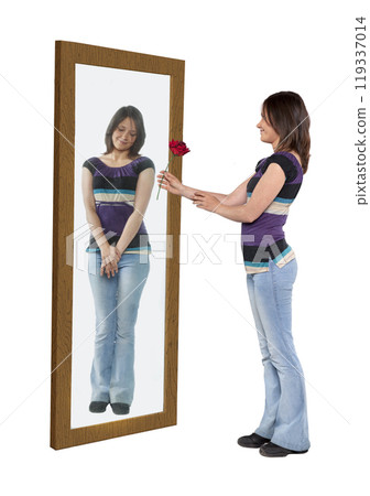 Young woman giving a flower to her reflection in a mirror Young woman giving a flower to her reflection in a mirror 119337014