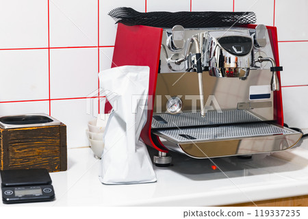 Professional coffee machine makes an espresso coffee, close-up 119337235