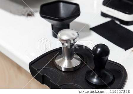 Set of barista tools is on white desk 119337238