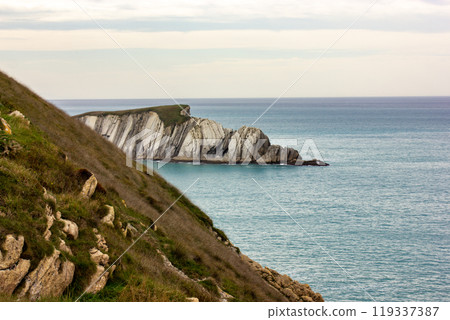 Rocky coastline of Santa Cruz de Besana, Cantabria province of Spain, Santander. Journey to the Atlantic ocean, the sea. Beautiful view from the top to the horizon and calm blue water Amazing seascape Rocky coastline of Santa Cruz de Besana, Cantabria province of Spain, Santander. Journey to the Atlantic ocean, the sea. Beautiful view from the top to the horizon and calm blue water Amazing seascape 119337387