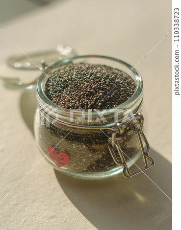 Chia seeds in glass jar. Healthy superfood rich in Omega 3 fatty acids. High quality photo 119338723