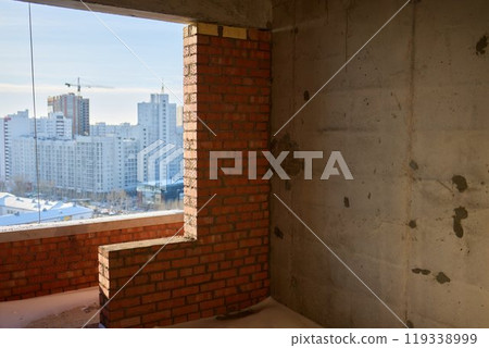 Construction worker laying bricks on exterior walls Construction worker laying bricks on exterior walls 119338999
