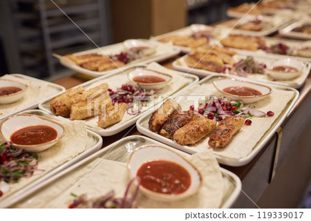 Tasty dishes in restaurant with beef steak, salad and barbecue chicken wings. Food menu concept Tasty dishes in restaurant with beef steak, salad and barbecue chicken wings. Food menu concept 119339017
