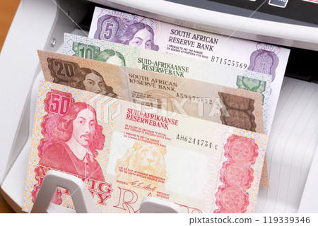 Old South African money in the counting machine Old South African money in the counting machine 119339346