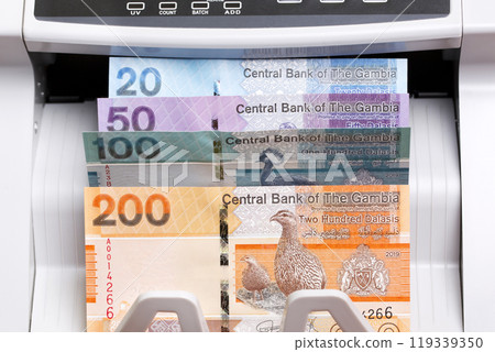 Gambian dalasi in the counting machine Gambian dalasi in the counting machine 119339350